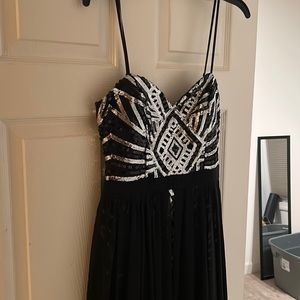Black and silver sequined prom dress with slit in back